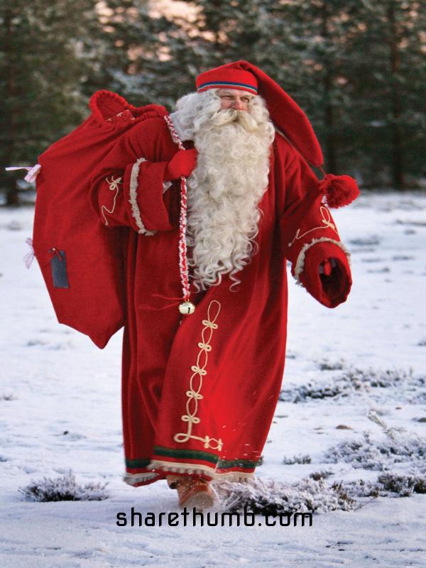 Santa in full of red colour dress in the snow walk